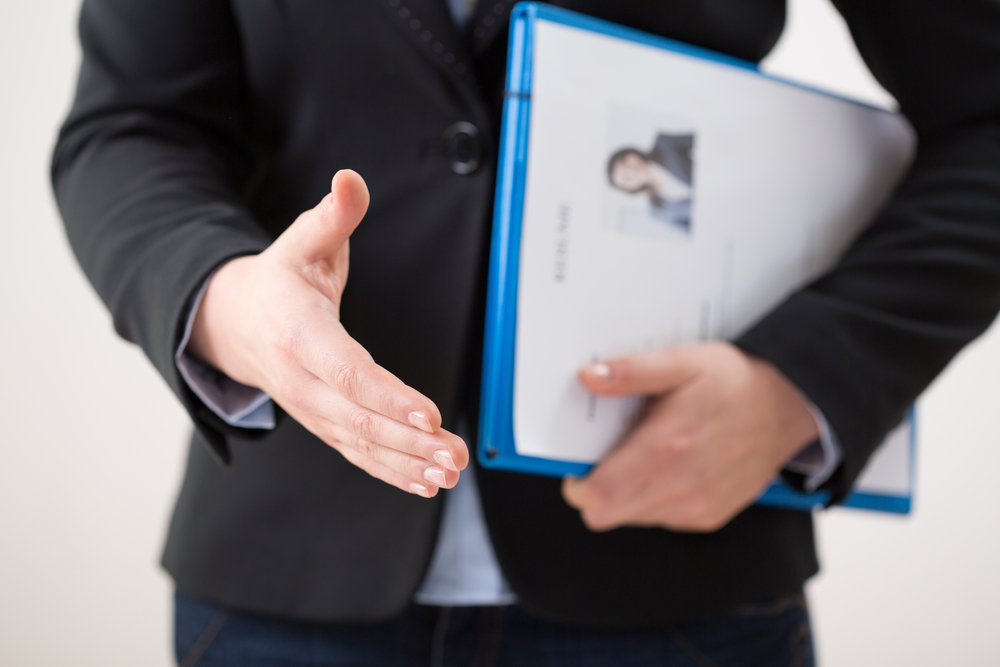 Horizontal view of woman with her curriculum vitae-3